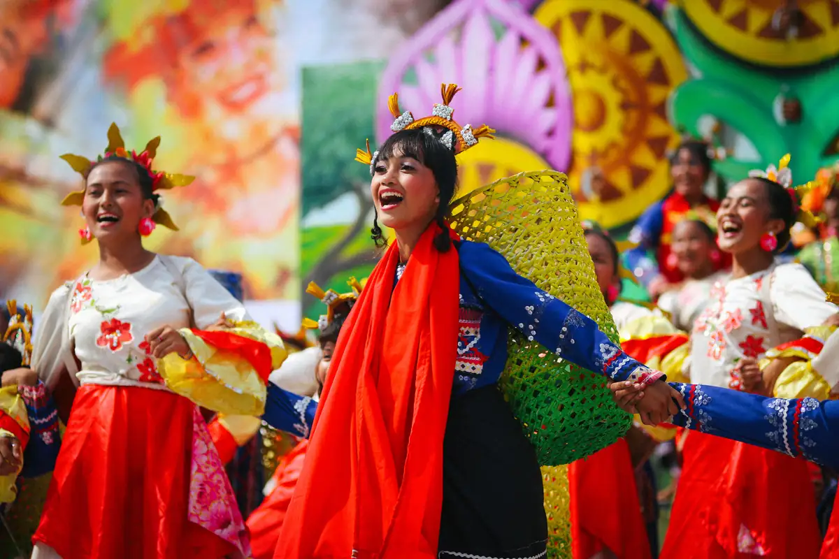 Street dancers in bright costume at a festival parade